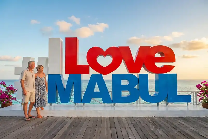 Iconic photo spot at the I Love Mabul sign on Mabul Island Sand Bay Resort