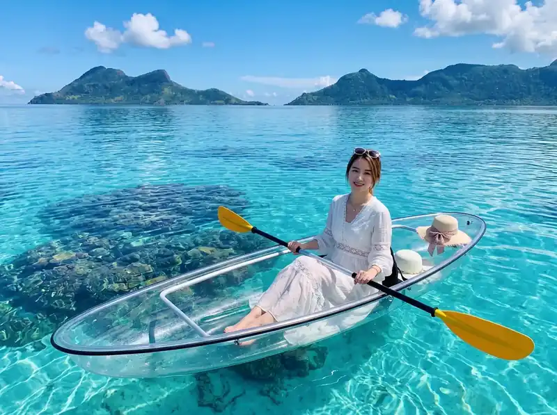 Kayaking in the turquoise lagoon near Bohey Dulang Sand Bay Resort